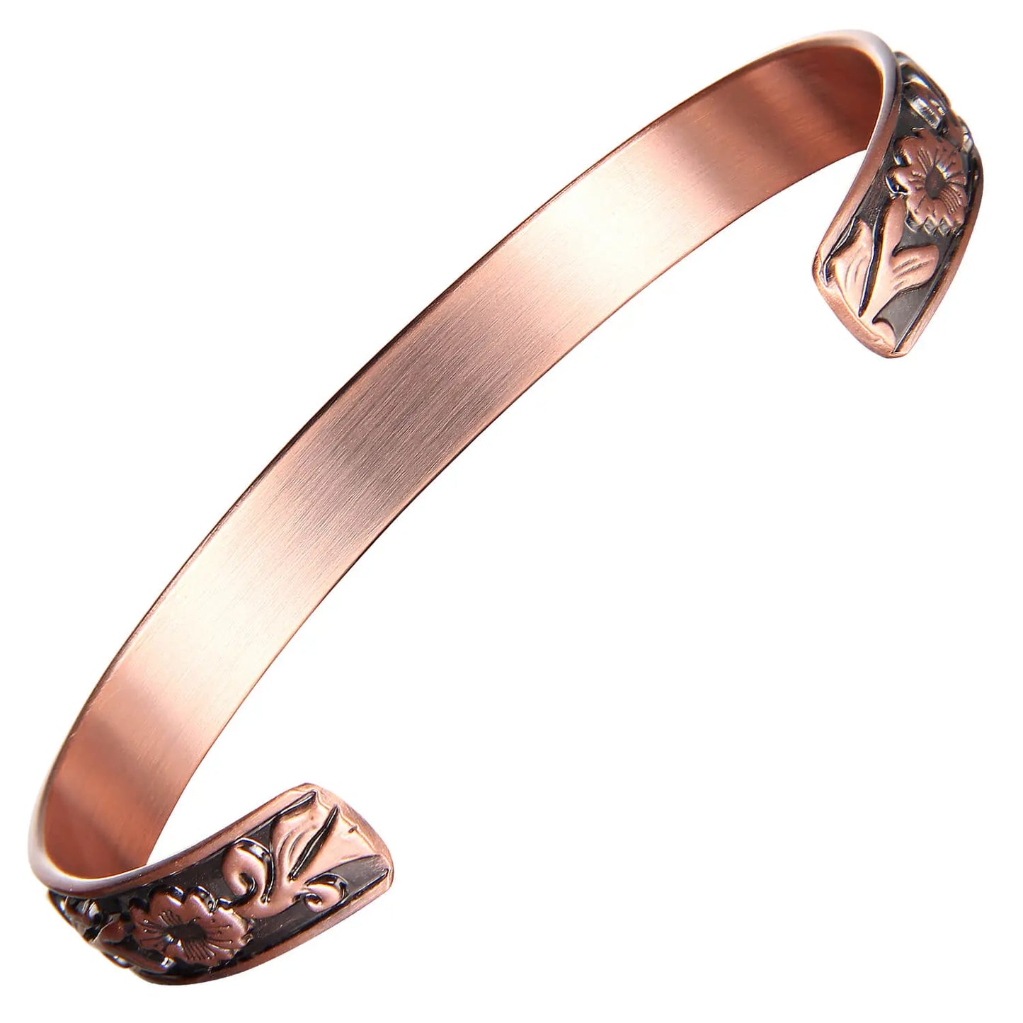 copper bracelet cuff with floral designs on a white background