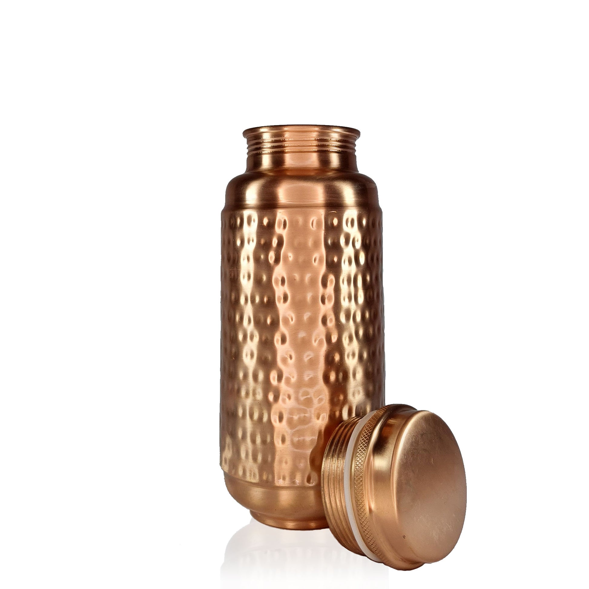 Jumbo Copper Water Bottle Hammered Design 1.3L with lid placed on the side of the bottle by Atomic29