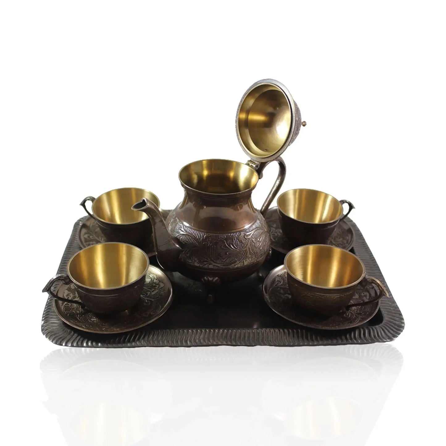 Brass tea set with teapot, cups, and tray on a white background