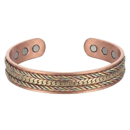 A copper cuff bracelet featuring a textured braided pattern of copper, bronze and cupronickel on the front and three circular magnetic inserts on each end, shown against a plain white background.