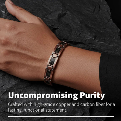 Hand wearing carbon fibre copper bracelet on a dark stone background with text about material composition.