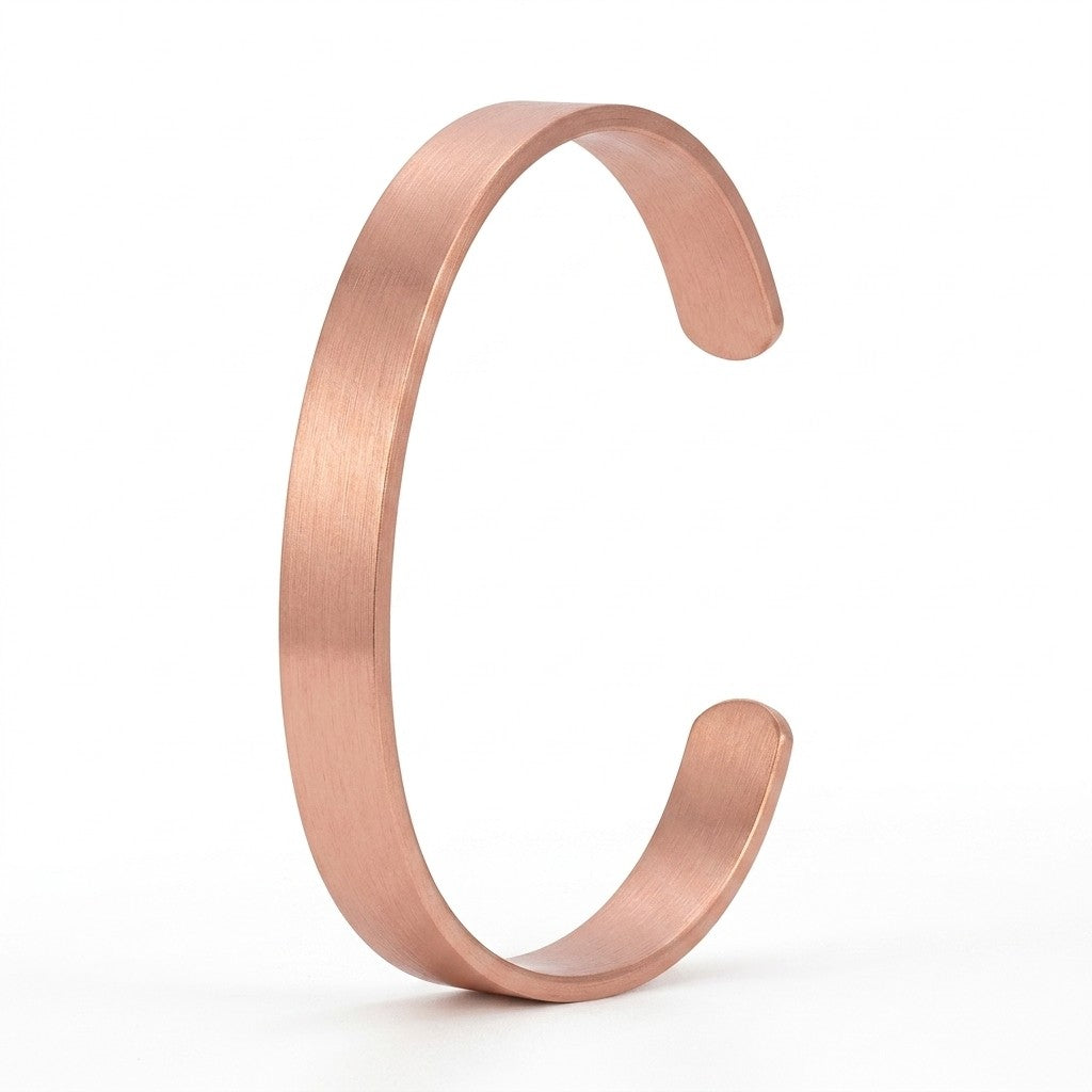 A minimalist copper cuff bracelet in smooth polish, shown on a clean white background.
