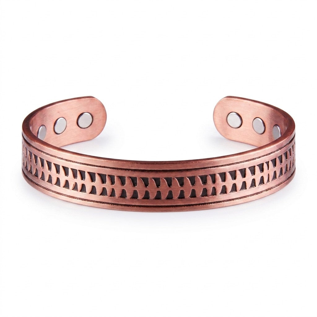 A copper cuff bracelet with arrow embossed patterned design across the front and three circular magnets on each end, shown on a plain white background.