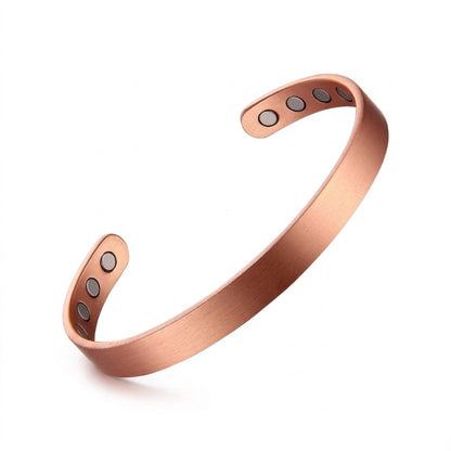 A smooth polished copper magnetic therapy open cuff bracelet with four circular magnets on each end, displayed on a clean white background.
