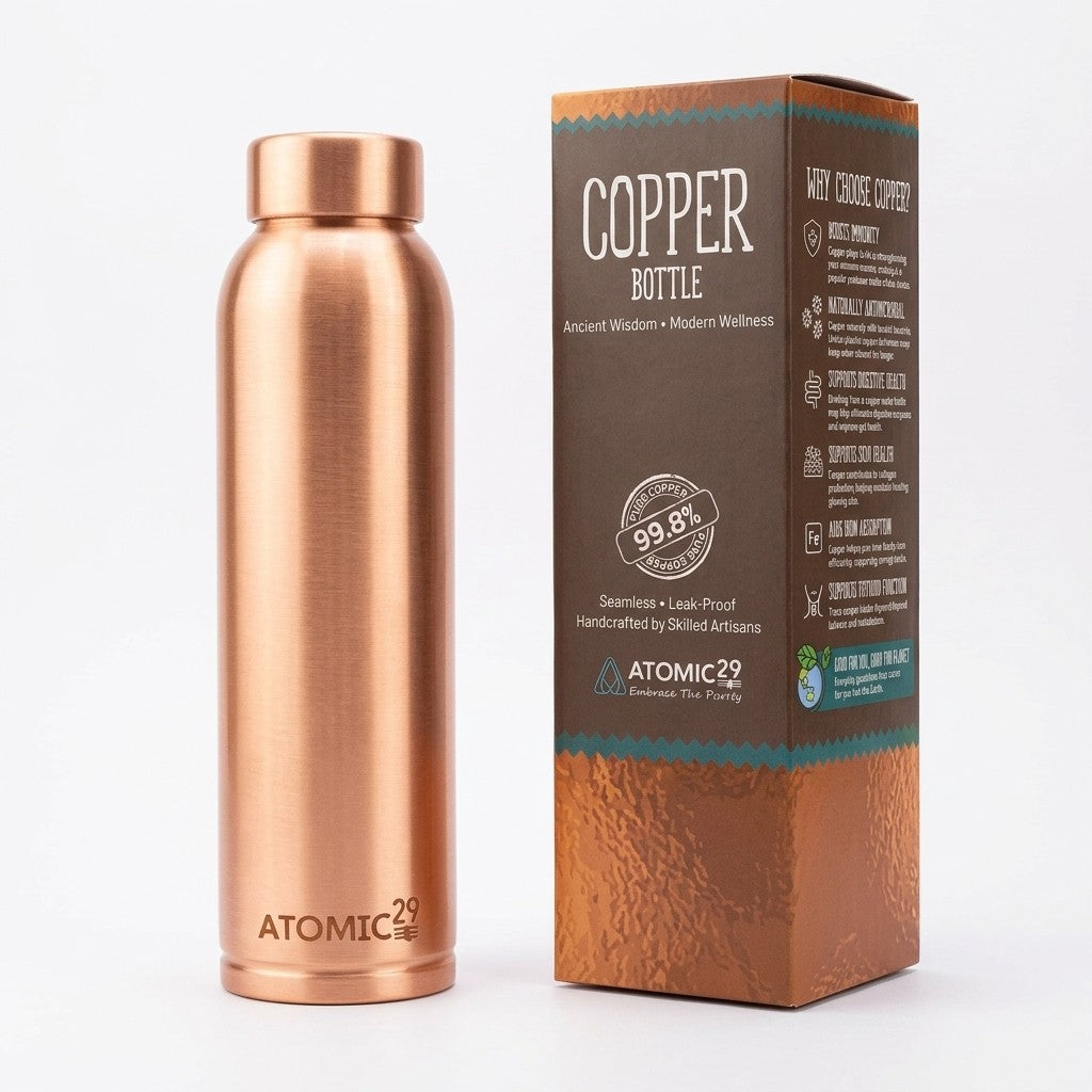 A copper insulated water bottle stands next to its branded retail box on a clean white background. The bottle has a brushed metallic finish and the box reads 'COPPER BOTTLE' with product details.
