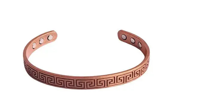Copper magnetic bracelet with block Greek key design on a white background