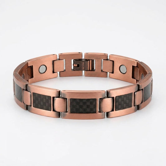 A copper magnetic link bracelet with black carbon fibre rectangle inlays, displayed on a clean white background.
