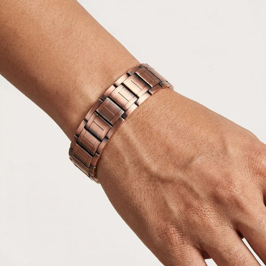 Rugged Flexi copper bracelet on a wrist against a light background
