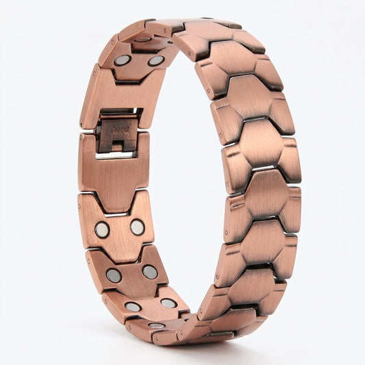 A copper magnetic link bracelet with a  hexagonal design, shown on a light grey background.