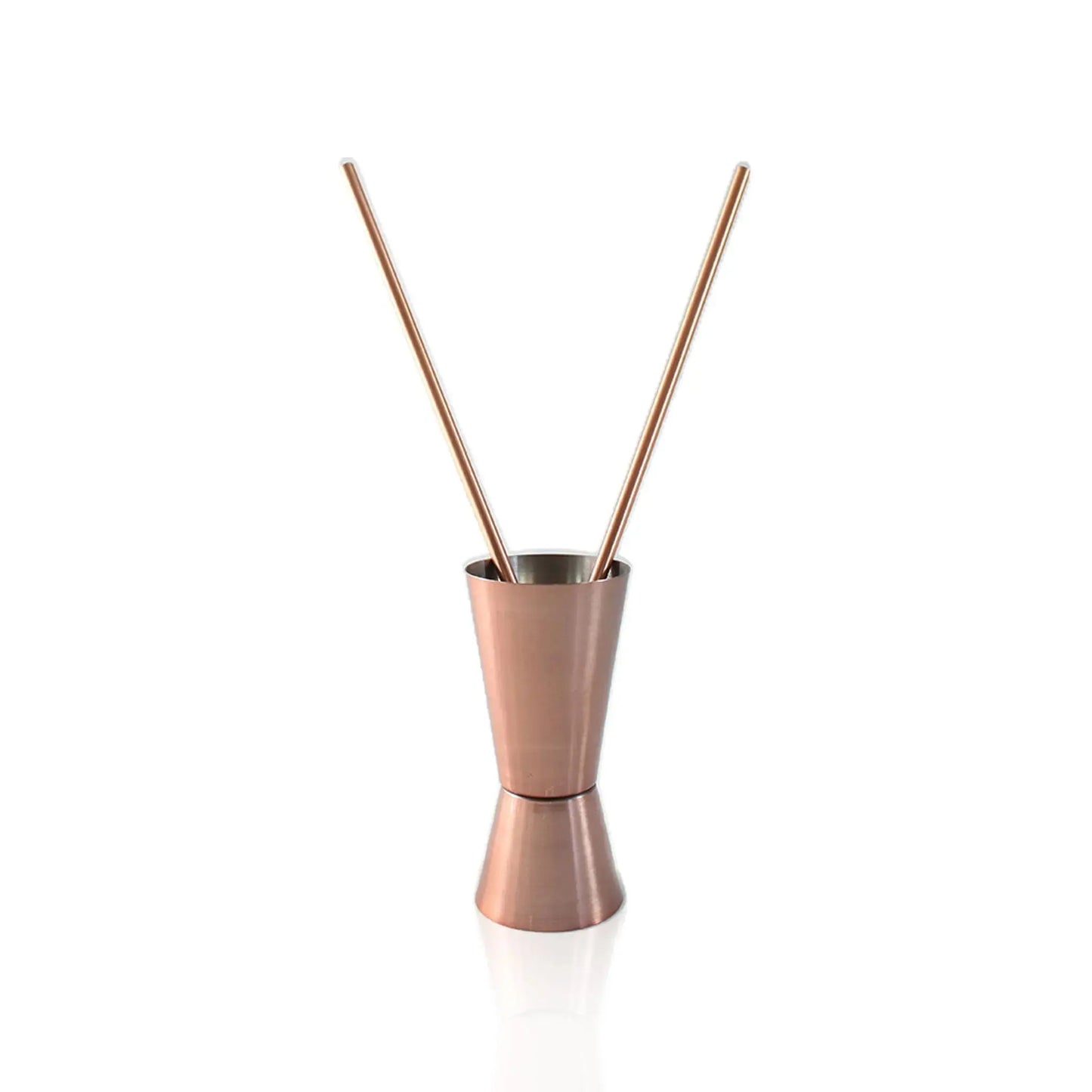 jigger with two copper straws on a white background