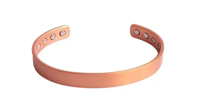 Copper bracelet on a white background