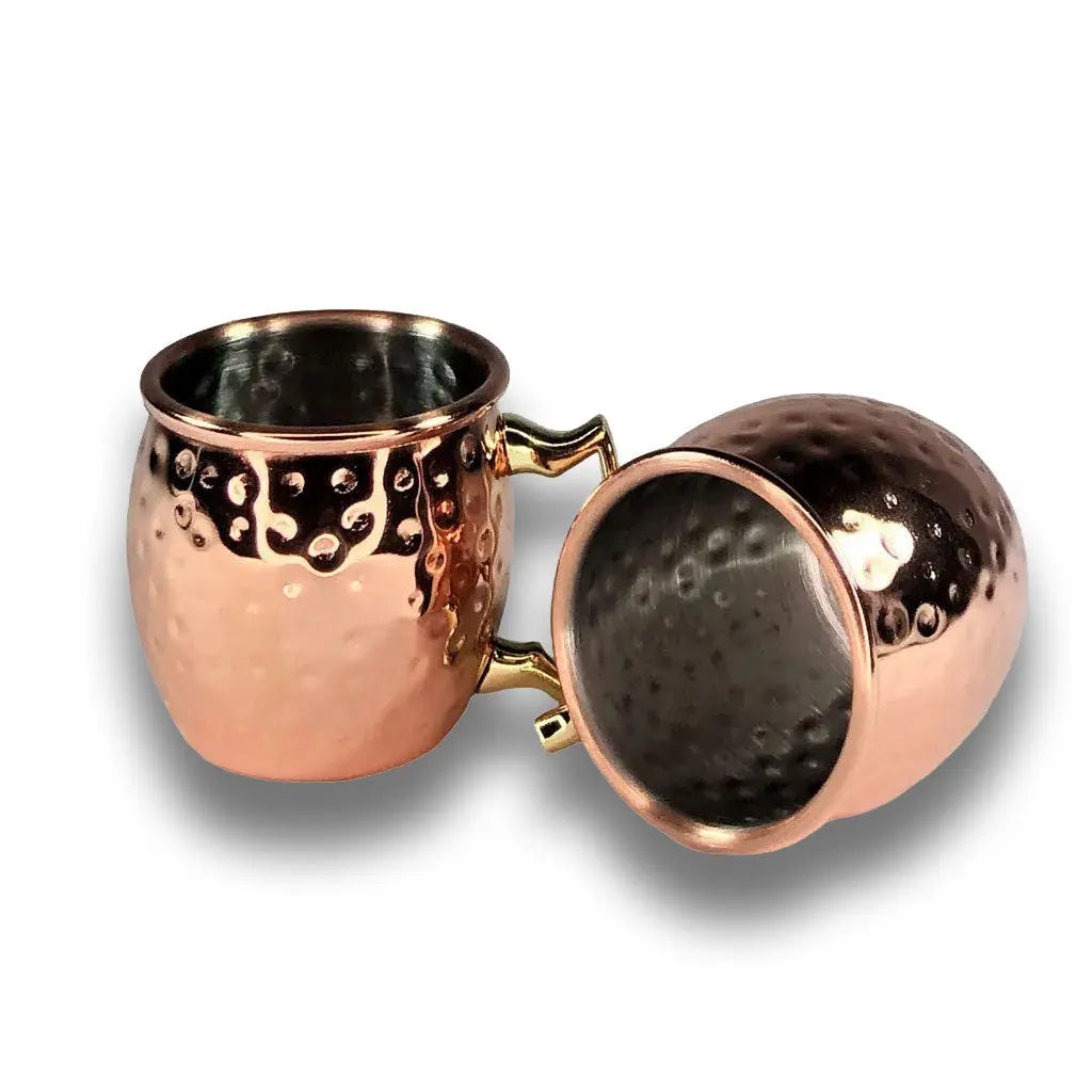 Copper shot mugs on a white background