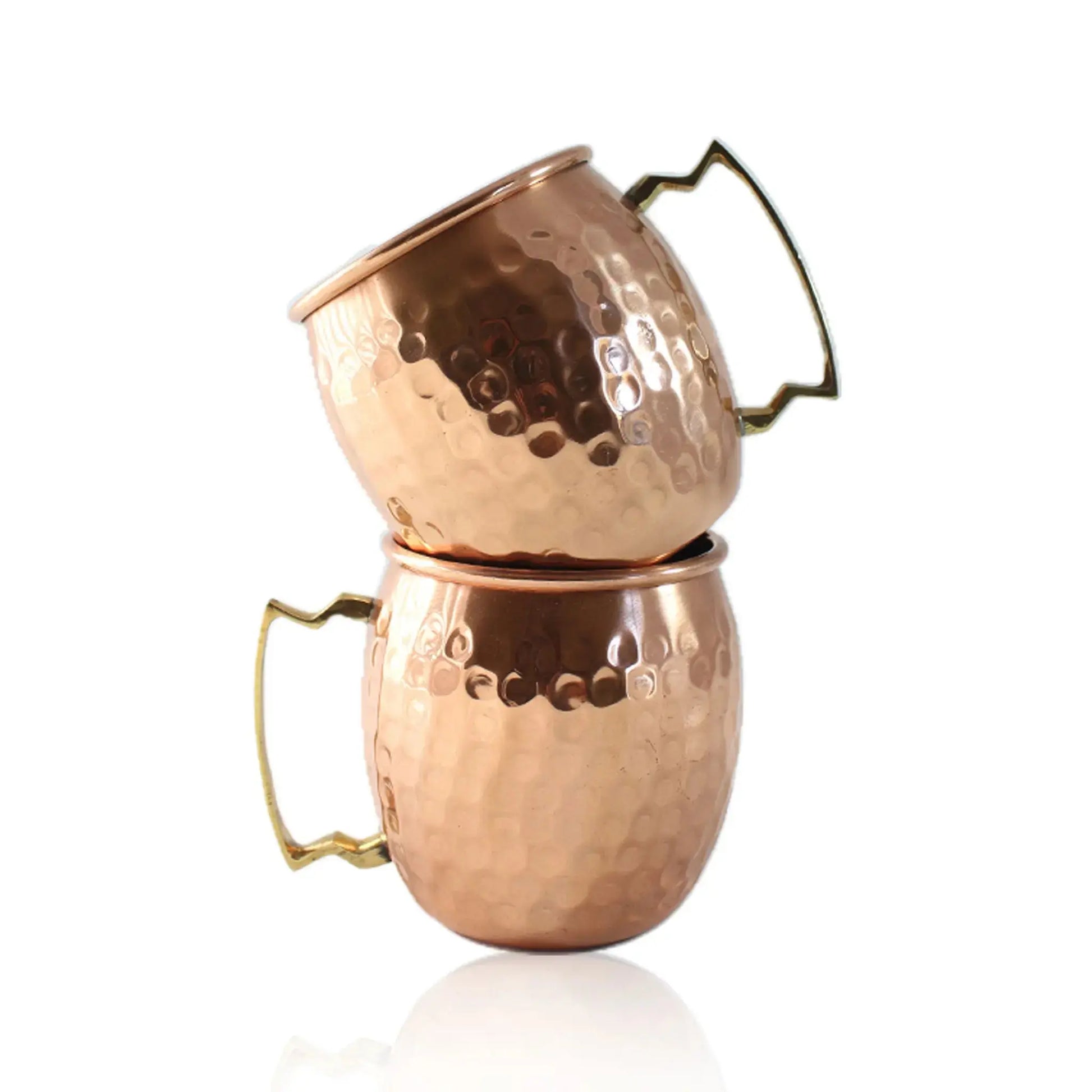 Two copper mugs with handles on a white background